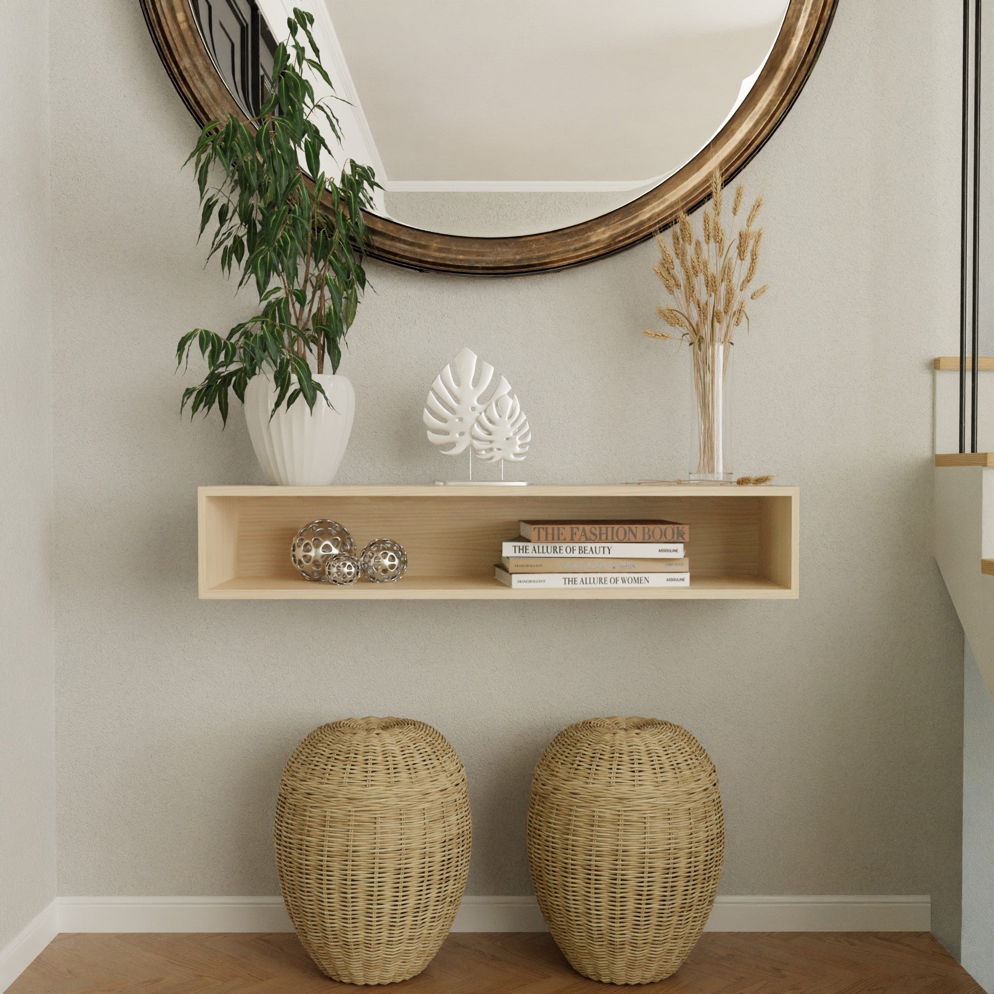 A minimalist entryway with a round mirror above a wooden shelf holding decorative items, books, and a plant. Below the shelf are two wicker baskets on a wooden floor.