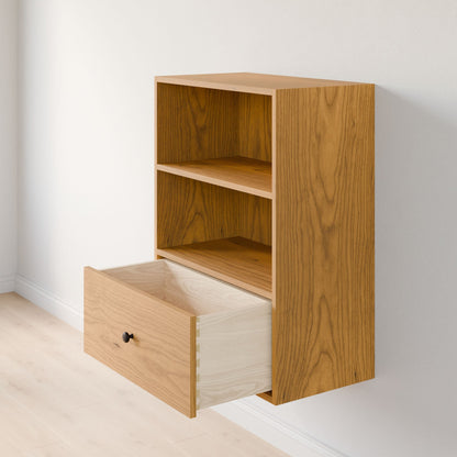 The Closet Drawers and Shelves in Cherry by Krovel Furniture Co. is a wooden, wall-mounted cabinet with premium grade plywood construction and two open shelves, complementing a light-colored wall and floor with its natural wood grain finish and solid Maple drawers. 