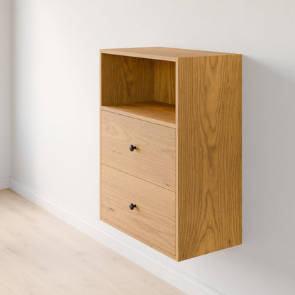 The Closet Drawers and Shelves in Cherry by Krovel Furniture Co. is a premium wall-mounted cabinet made from top-grade plywood. It features an open shelf and two solid Maple drawers with black knobs, beautifully set against a white wall above a light wood floor. 