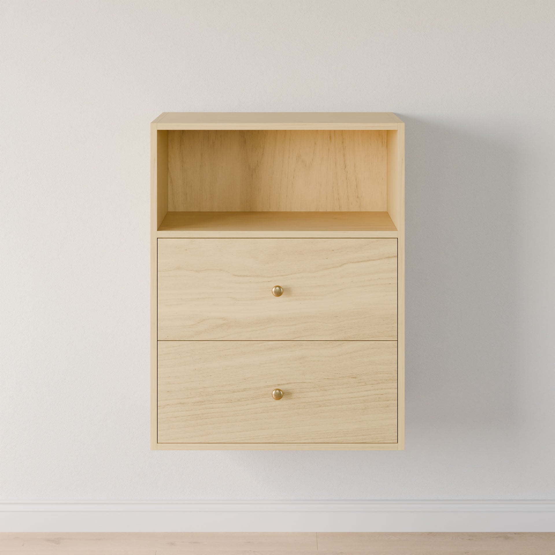 The "Closet Drawers and Shelves in Maple" by Krovel Furniture Co. is a wall-mounted, premium grade plywood light wood cabinet, featuring an open shelf on top and two drawers with small round metallic knobs, set against a plain white wall above a light wood floor. 