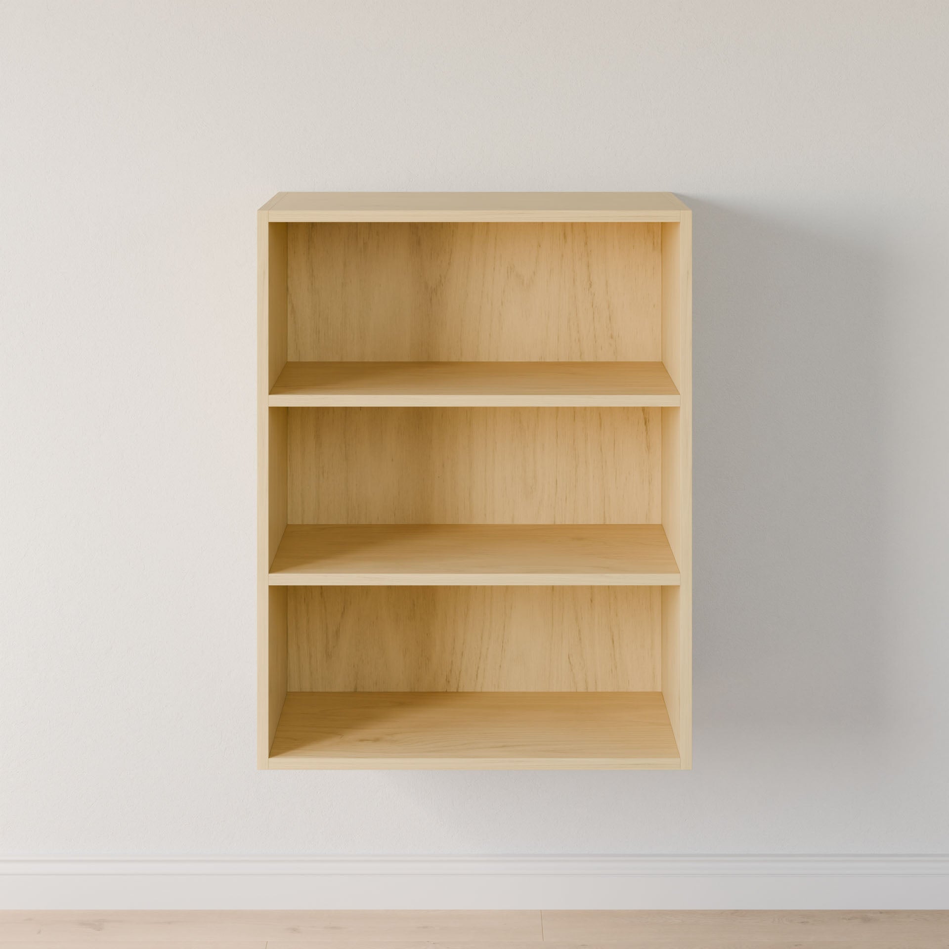 A light wooden wall-mounted bookshelf by Krovel Furniture Co., made from premium-grade plywood, features three shelves against a plain white wall and is slightly above a light-colored floor, ready to transform the space with subtle elegance. #configuration_triple-shelf