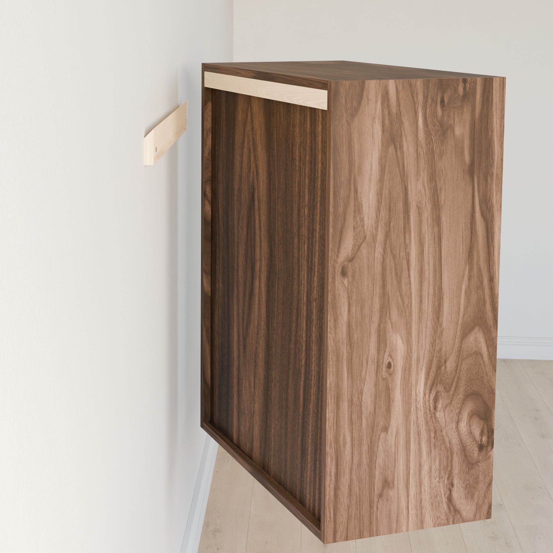 The "Closet Drawers and Shelves in Walnut" by Krovel Furniture Co. are installed on a wall using a support strip. The cabinet's dovetail construction and natural walnut finish stand out against the white-painted wall, with a light-colored wood floor adding to the elegant setup. #configuration_triple-shelf