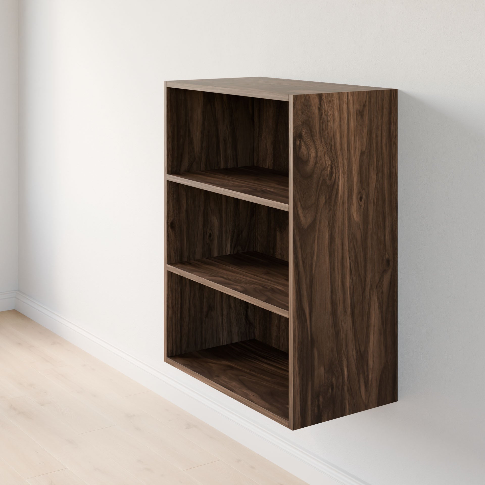 The Closet Drawers and Shelves in Walnut by Krovel Furniture Co. is a wall-mounted, small rectangular bookshelf featuring dovetail construction with three shelves and dark wood grain texture, set against a light-colored wall on a light wooden floor. #configuration_triple-shelf