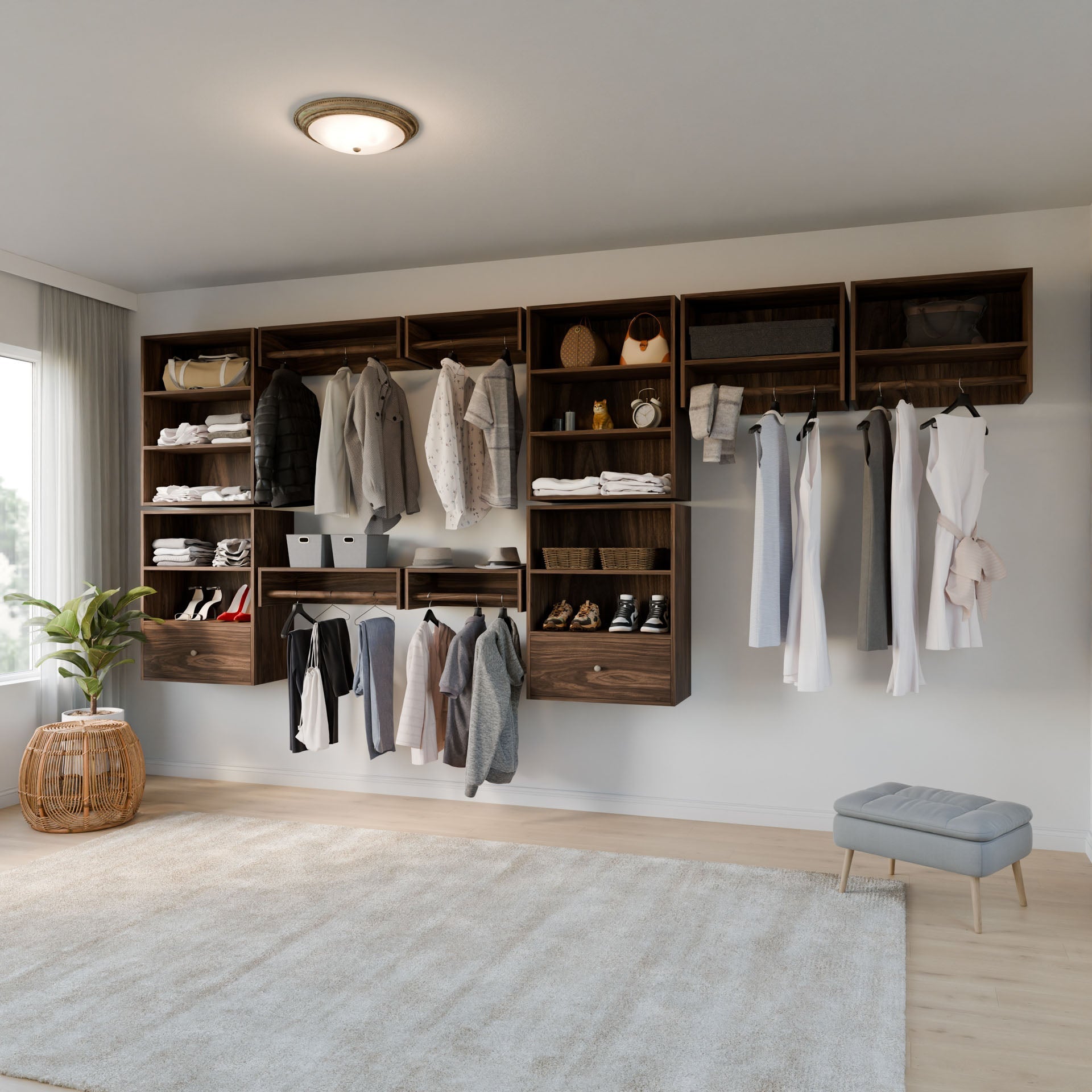 The walk-in closet features modular walnut shelves and hanging rods from Krovel Furniture Co., displaying a curated collection of clothes, shoes, and accessories. A soft gray rug covers the floor beside a small cushioned stool, with natural light filtering through sheer curtains. 