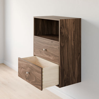 The Krovel Furniture Co.'s wall-mounted Closet Drawers and Shelves in Walnut features dovetail construction, an open shelf, and two drawers. The partially open bottom drawer shows a light interior against a light-colored wall and floor. 