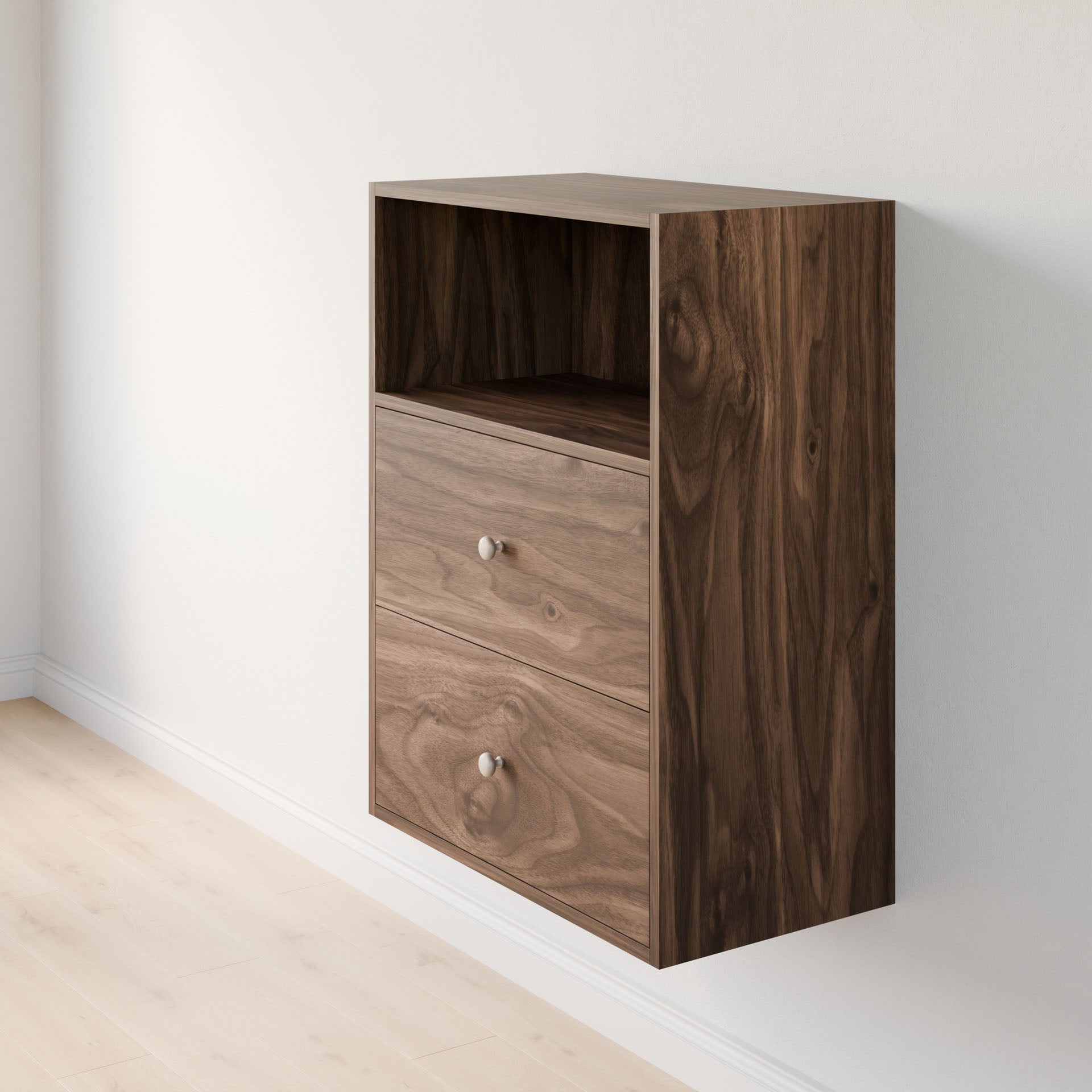 A wooden wall-mounted cabinet from Krovel Furniture Co.'s Closet Drawers and Shelves in Walnut collection, featuring two drawers and an open shelf with a natural wood grain pattern. It rests against a light-colored wall on a light wood floor, showcasing exceptional dovetail construction for durability and elegance. 