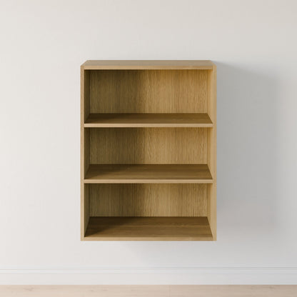 The Krovel Furniture Co.'s Closet Drawers and Shelves in White Oak, a modular wall-mounted unit crafted from premium plywood, features three evenly spaced shelves against a plain white wall. The light wooden floor complements its minimalist design, offering flexibility for closet customization. 