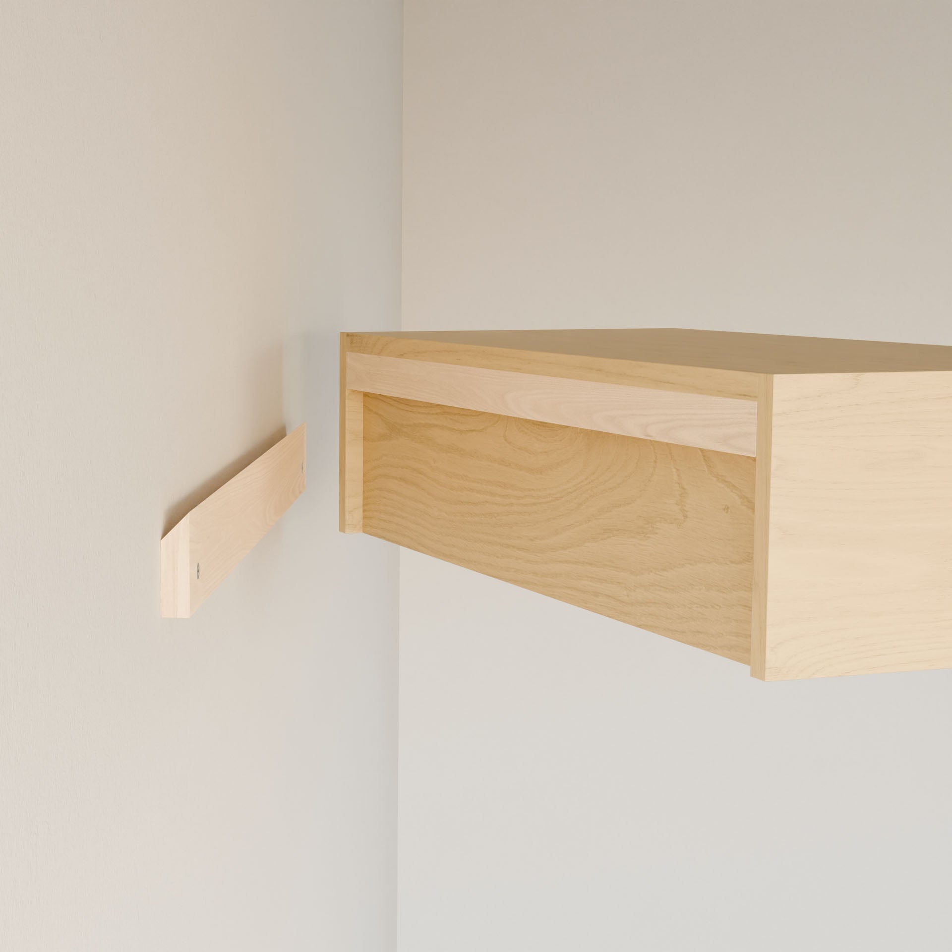 The Closet Hanger in Maple by Krovel Furniture Co., handmade from premium grade plywood, adds a minimalist touch to a white wall. With its bracket mounted on the left and ready for connection on the right, this modern design is perfect for any space.