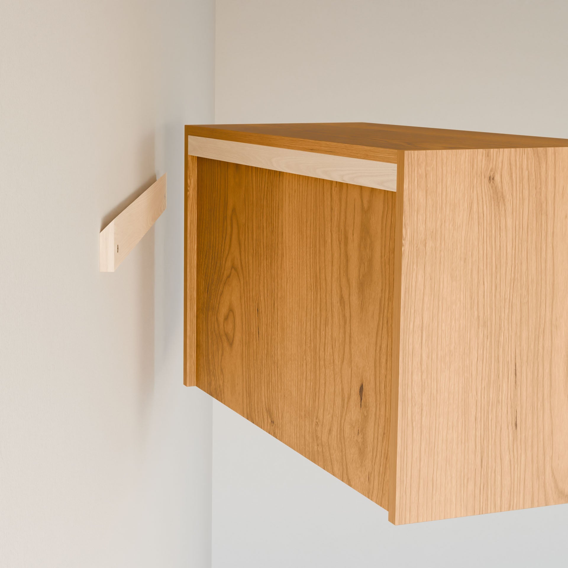 The Krovel Furniture Co. Closet Hanger with Shelf in Cherry is being installed with a cleat system. Its simple, rectangular design is made of premium grade plywood for durability and securely optimizes your space like a modular closet hanger.