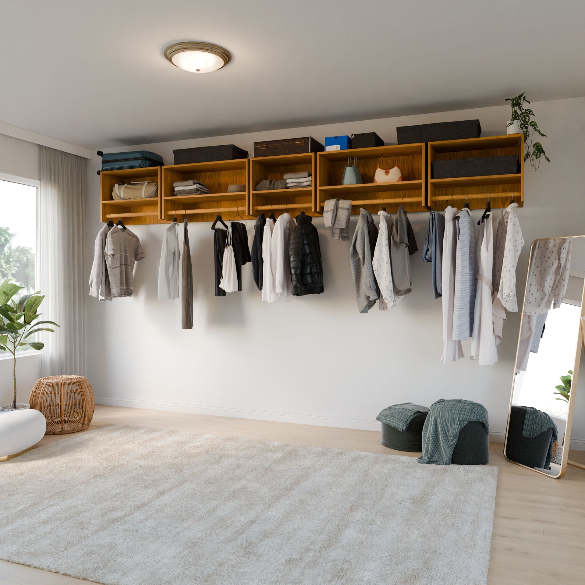 A modern, organized closet features Krovel Furniture Co.'s Closet Hanger with Shelf in Cherry, premium grade light wood shelves with baskets and decor. Hanging clothes include shirts and jackets. A floor mirror, plants, and poufs complement the beige rug on the hardwood floor.