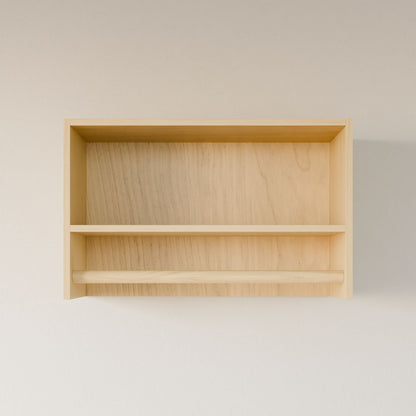 The Closet Hanger with Shelf in Maple by Krovel Furniture Co. is made from premium-grade cabinet plywood, featuring two levels and a natural finish. Its minimalist design enhances any space when mounted against a light-colored wall.