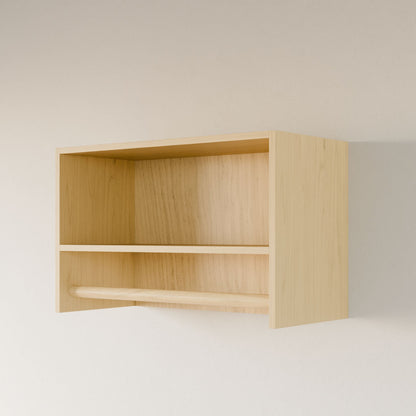 The Closet Hanger with Shelf in Maple by Krovel Furniture Co. is handcrafted in Portland, Maine with premium cabinet-grade plywood. It features a larger upper section, a lower wooden rod against a white wall, and a light natural finish that blends style and functionality seamlessly.