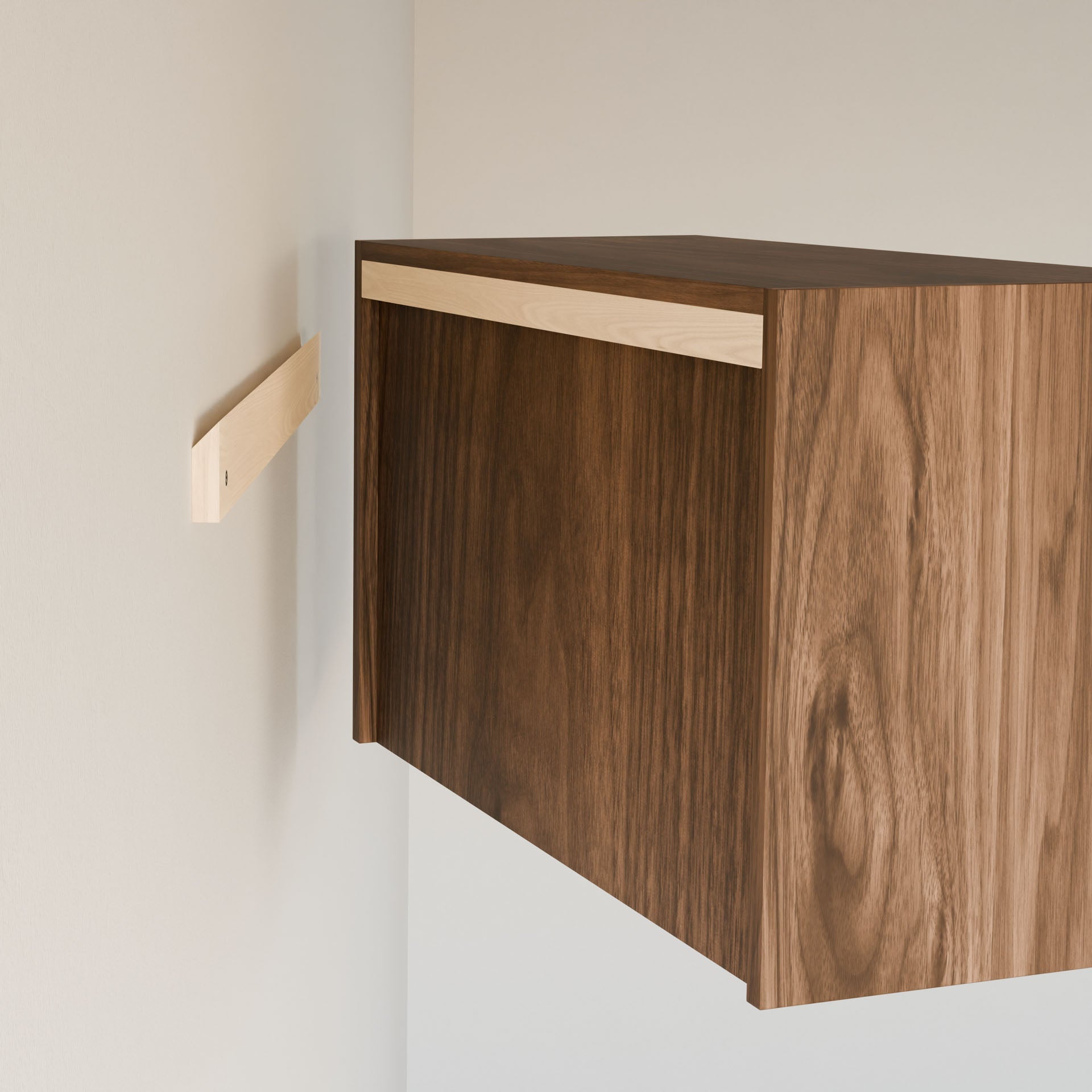 A Krovel Furniture Co. Closet Hanger with Shelf in Walnut, partially installed on a light wall, is handmade in Portland, Maine. A separate wooden mounting bracket indicates ongoing installation using premium-grade plywood.