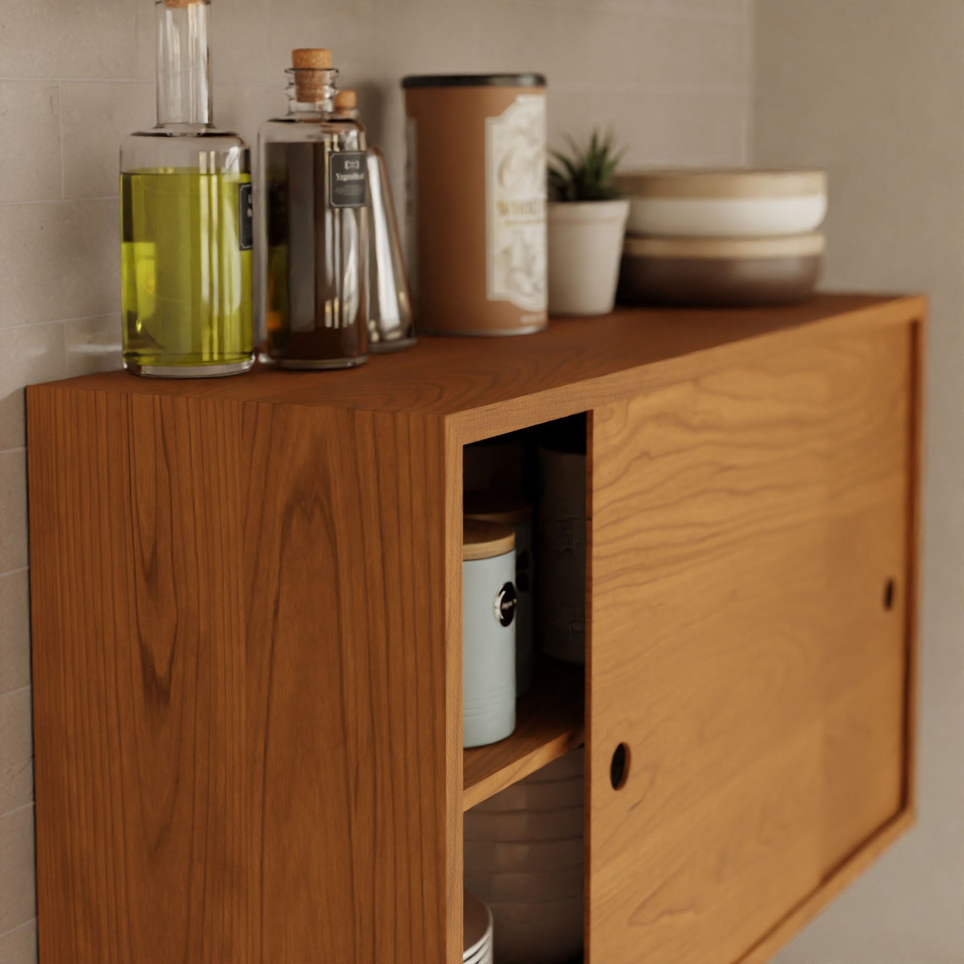 Introducing the Krovel's **Cupboard with Shelf in Cherry**, a stylish wall-mounted cabinet featuring sliding doors that elegantly display various bottles and containers such as oil, seasonings, or small plants. Some items can be conveniently stored inside the open section of this floating storage solution. It's securely mounted using a French cleat system, ensuring both stability and aesthetics.