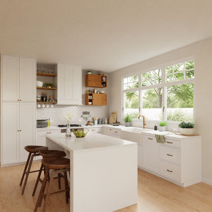 In a modern kitchen adorned with sleek white cabinets, a spacious central island is complemented by three wooden stools and boasts a sink perfectly aligned beneath a window. The elegance of French cleat-mounted floating storage cabinets is accentuated by the sunlight streaming in. Krovel's Cupboard with Shelf in Cherry showcases kitchenware, while vibrant green plants add life to the countertop.