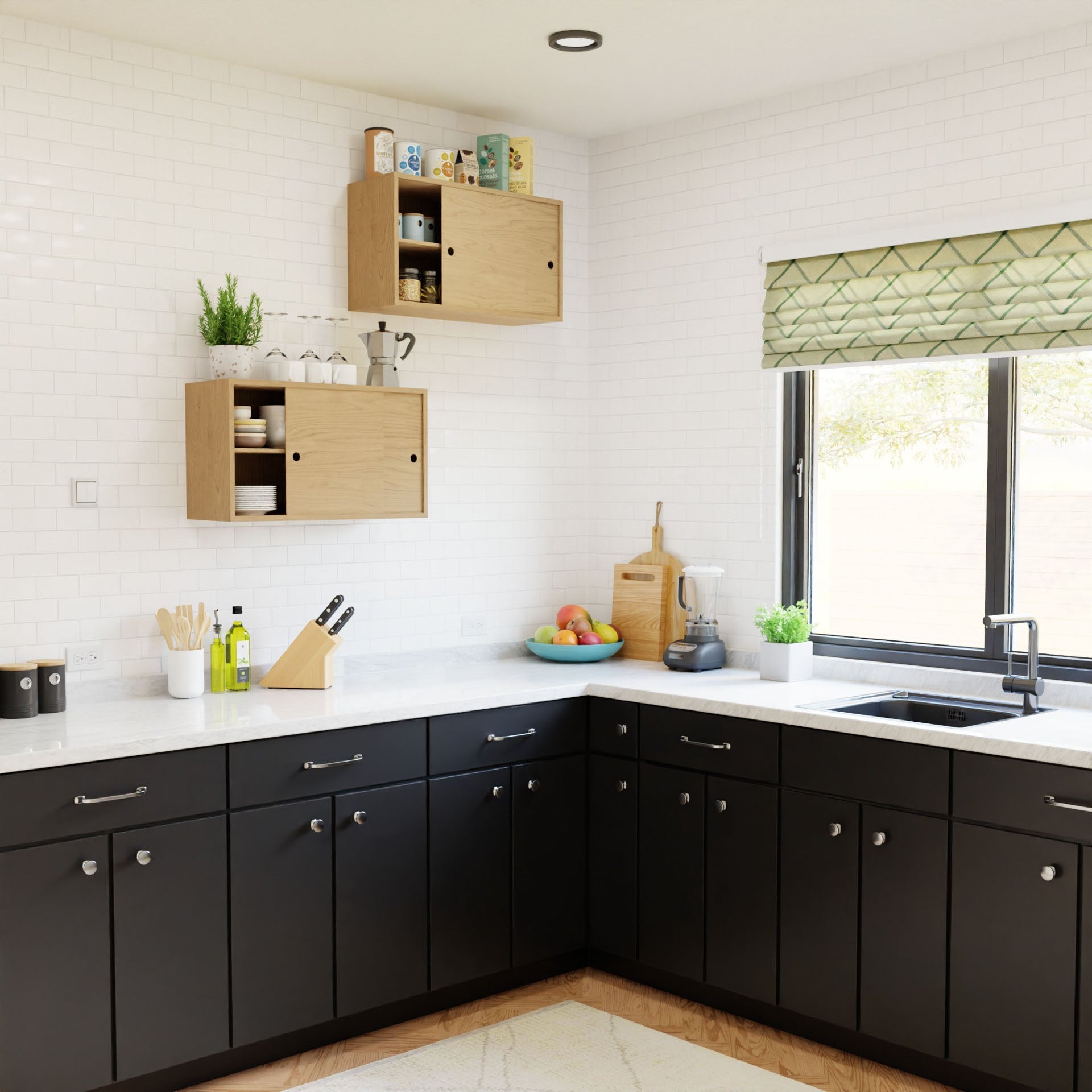 A modern kitchen showcases Krovel's Cupboard with Shelf in Maple, which features sleek black cabinets, a striking combination of white countertops, and a chic white tile backsplash. The wooden shelves incorporate the French cleat system for optimal storage of kitchen items. A spacious window above the sink is adorned with a green patterned shade, complemented by a fruit bowl and blender on the counter.