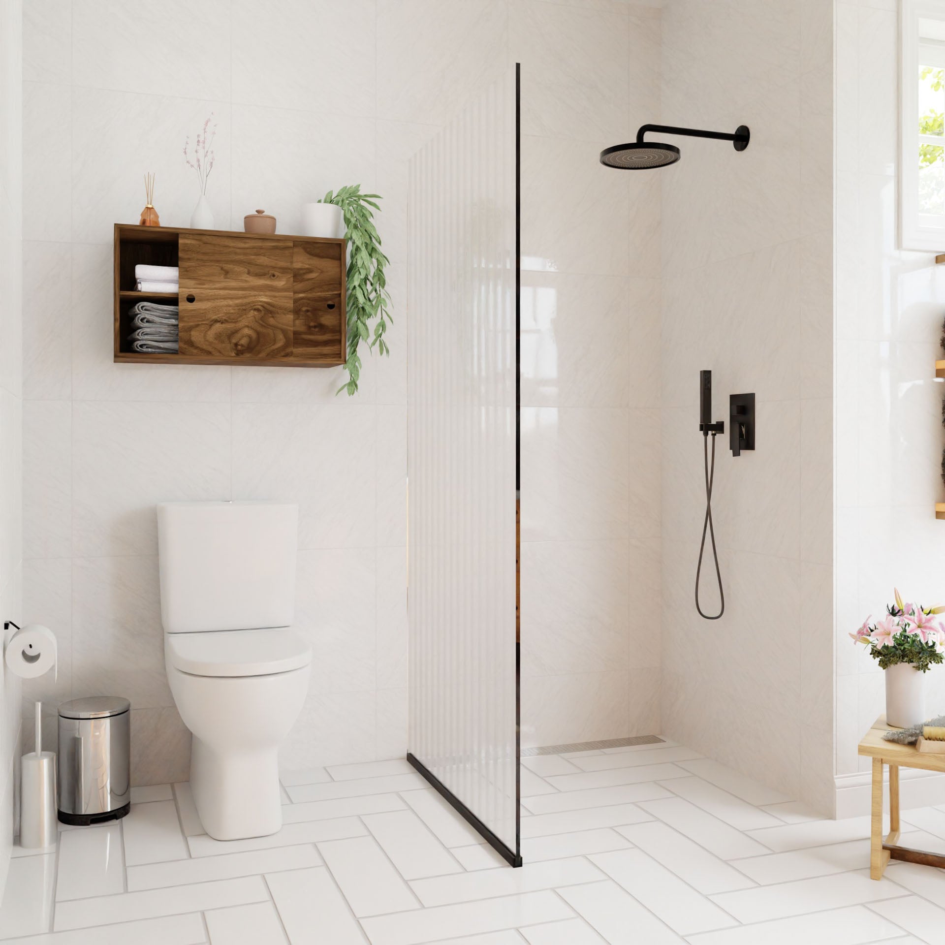 A modern bathroom showcases a walk-in shower featuring a black rain showerhead. The room is equipped with a white toilet and Krovel's Cupboard with Shelf in Walnut, adorned with hand-finished decor and accompanied by a potted plant. Natural light floods through the window onto the white herringbone-tiled floor.