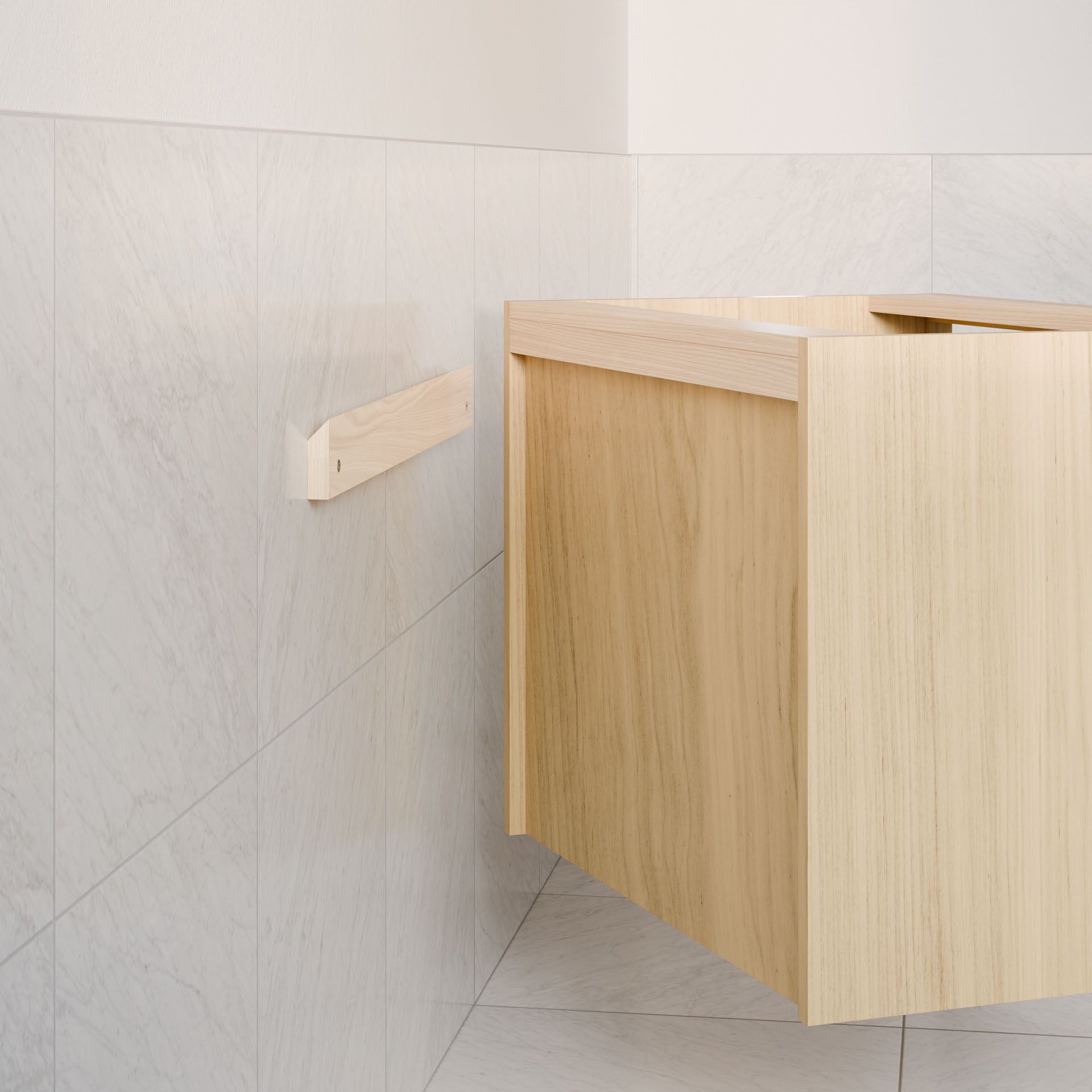 A minimalistic bathroom with light gray tiles showcases a custom-sized, wooden Krovel Furniture Co. Double Drawer, Open Shelf Vanity in Maple with clean lines. A touch of elegance comes from the hardwood veneer on the small towel rack mounted on the left wall.