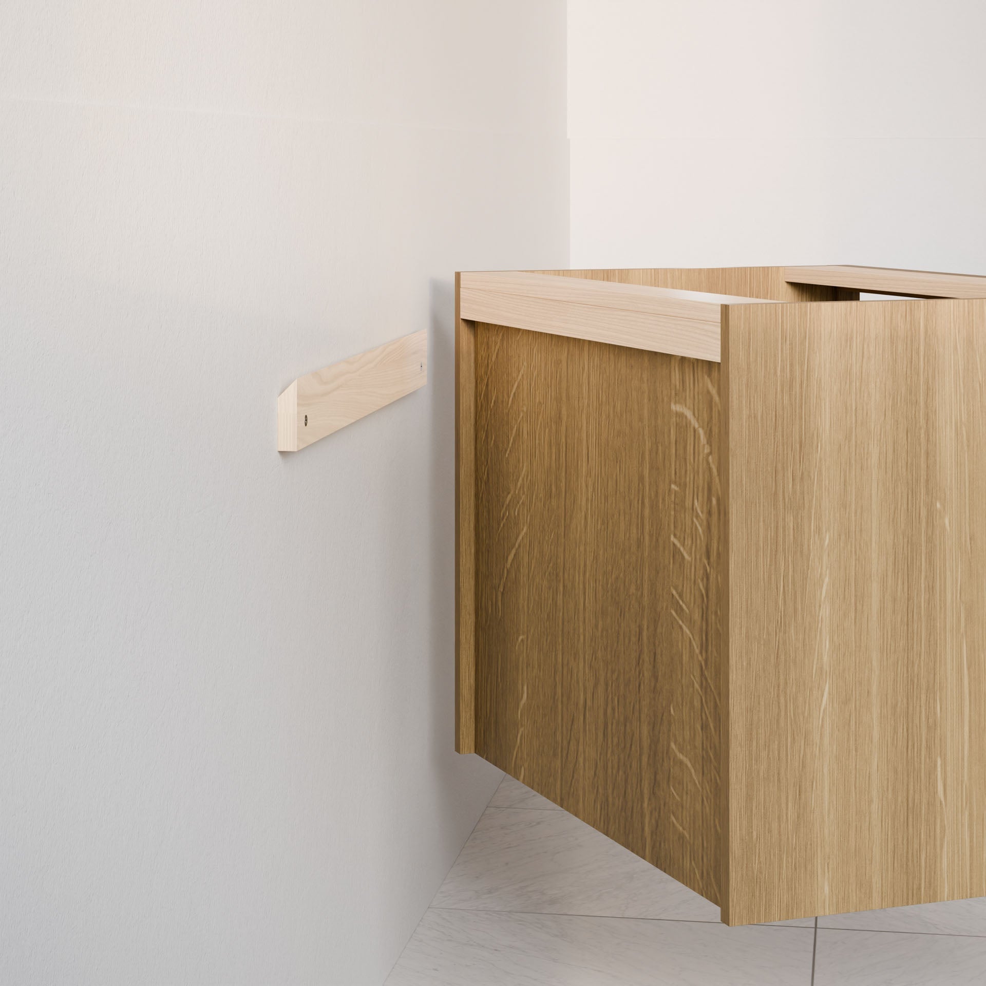 Krovel Furniture Co.'s Double Drawer, Open Shelf Vanity in White Oak, showcasing a minimalist design with a light hardwood veneer finish, is being mounted on a beige wall using a wooden support bracket. The floor features light-colored tiles, enhancing the simple, modern aesthetic.