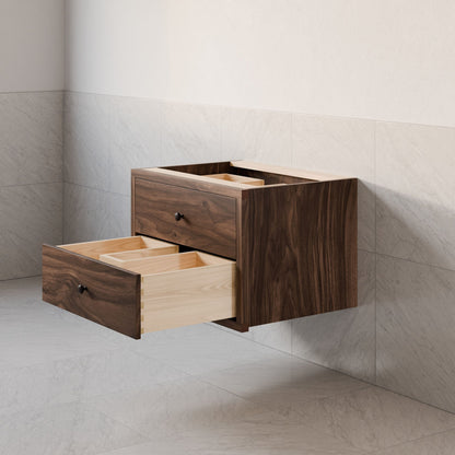 The Double Drawer Vanity in Walnut by Krovel Furniture Co. is highlighted. It features two open drawers against a tiled wall, revealing the empty light wood interior, while the floor boasts light gray tiles.