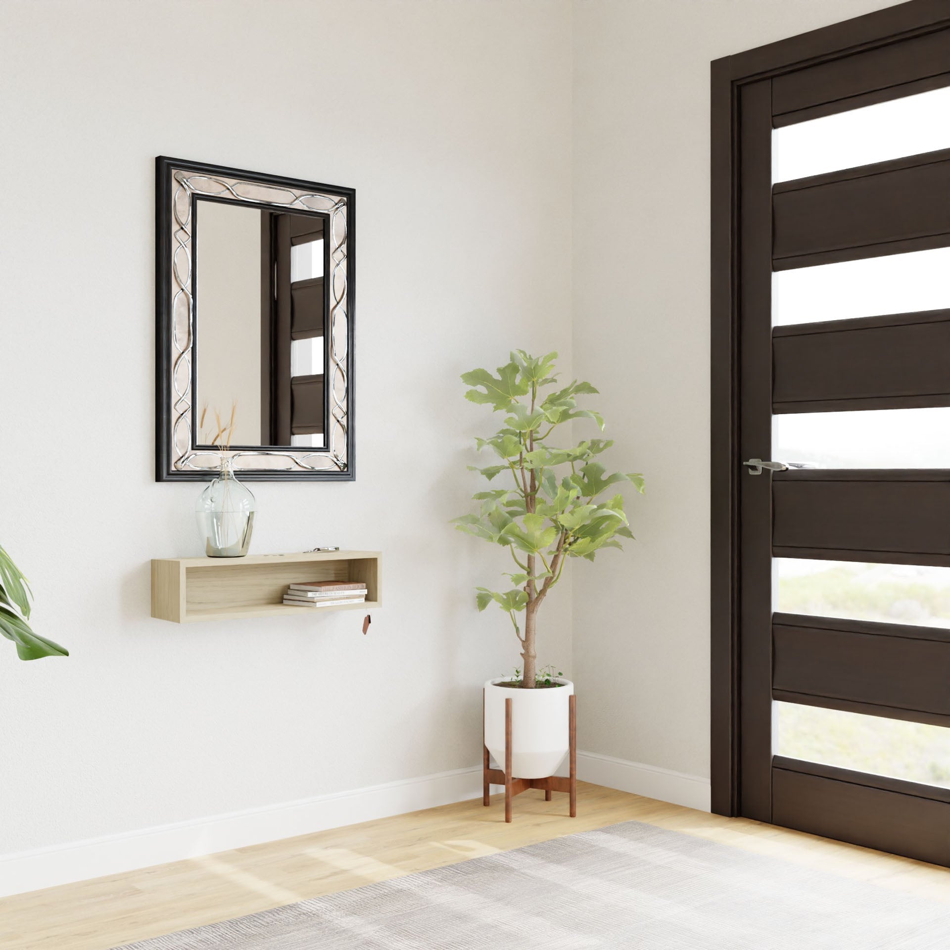 In the modern interior, a rectangular mirror with a decorative frame is elegantly mounted on a white wall using a french-cleat system. Below it, the Entryway Organizer in Maple from Krovel holds a vase and books. Beside the dark brown contemporary door stands a tall potted plant.