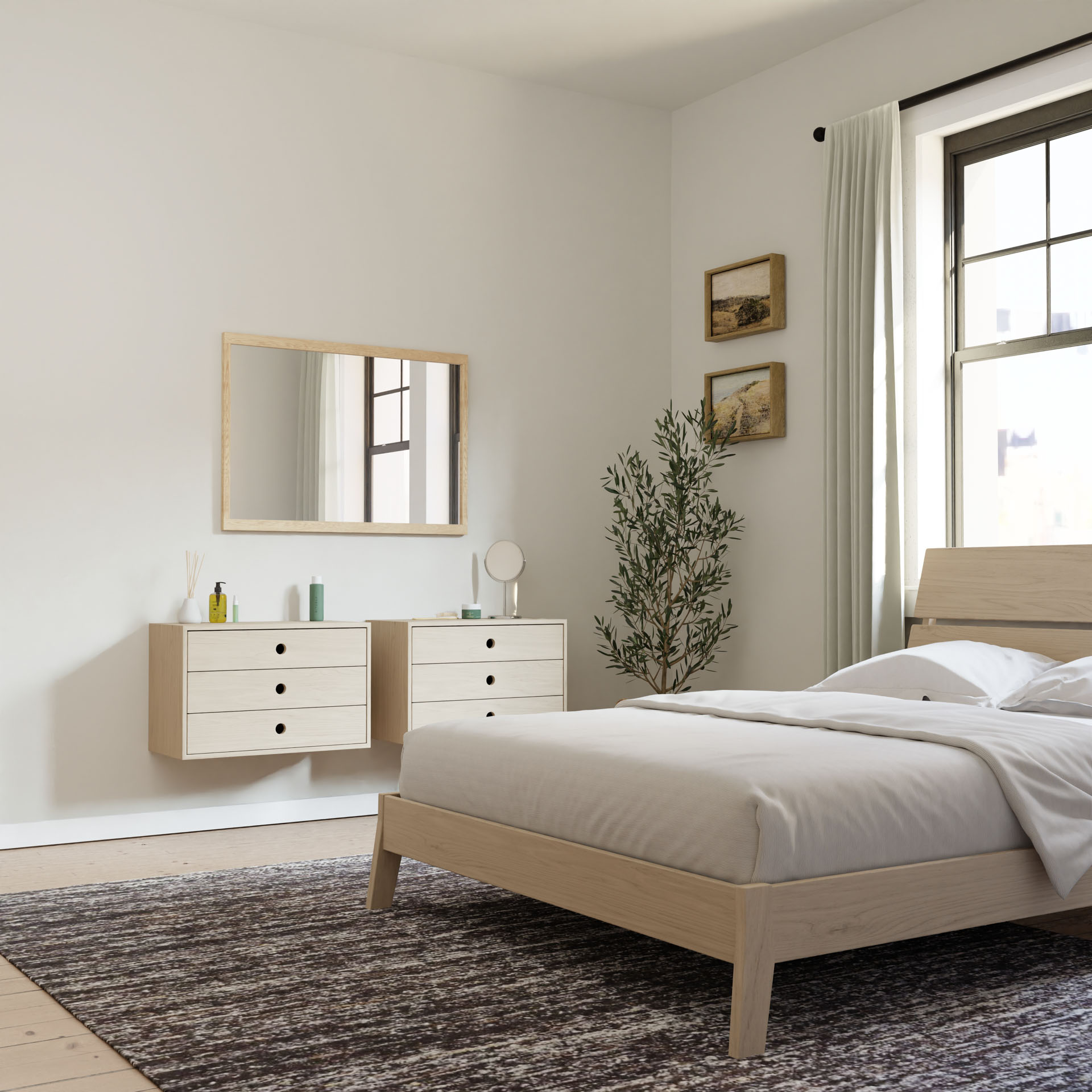 A minimalist bedroom showcases a light wood bed and Krovel's Floating Dresser in Maple with soft-close slides, paired with a large mirror and olive tree. Neutral tones, a textured rug, and light-colored curtains by the window complete the serene atmosphere.