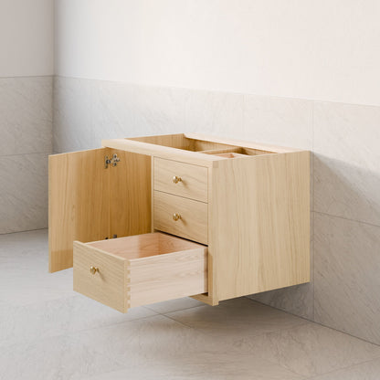 The Krovel Furniture Co.'s maple Single Door, Triple Drawer Vanity features a wooden design with three soft-close drawers and a single open door. The top drawer is closed while the middle and bottom ones are open, revealing their empty interiors, mounted against a tiled wall.