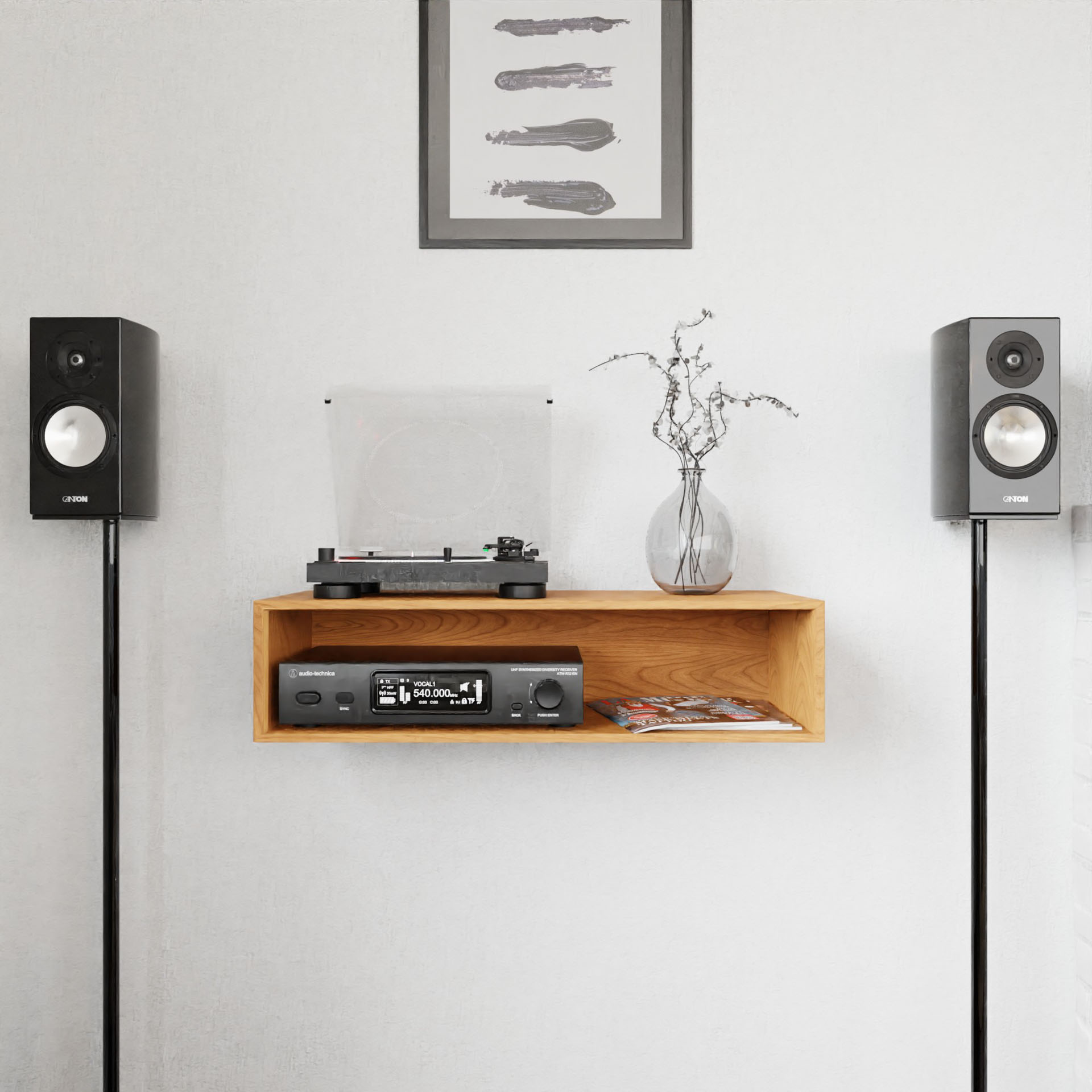 A modern minimalist audio setup showcases Krovel's Stereo Table in Cherry. Positioned on either side are two standing Yamaha speakers, while a wooden shelf accommodates a stereo receiver and a magazine. A turntable is elegantly placed above it all, and the arrangement is completed by a simple framed artwork hanging on the white wall, enhancing this mid-century modern design.